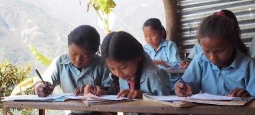 Girls writing in class